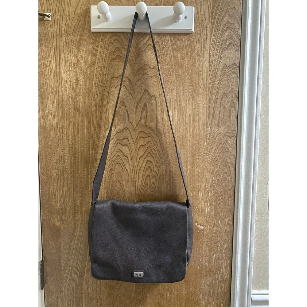 The Sak Crossbody Bag Brown Leather Satchel Flap Inside Pockets Divider Used